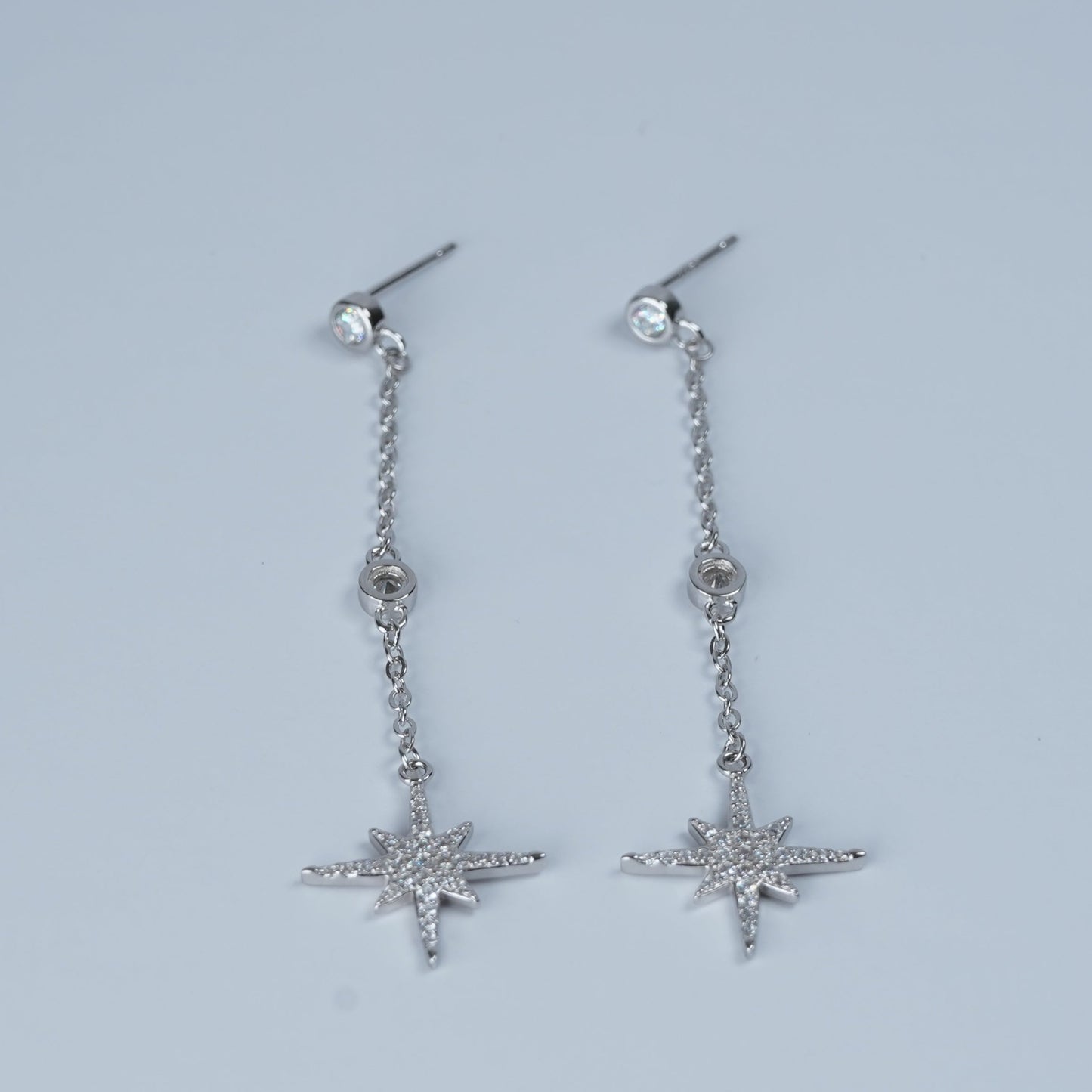 Sparkling dangling starburst earrings