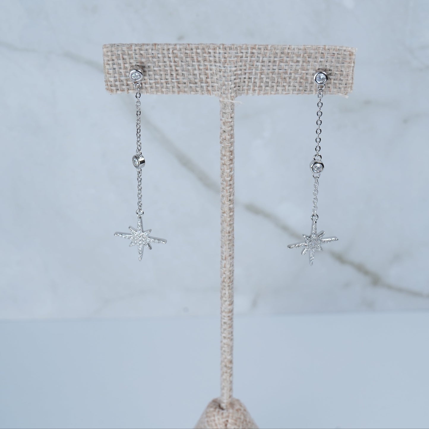 Sparkling dangling starburst earrings