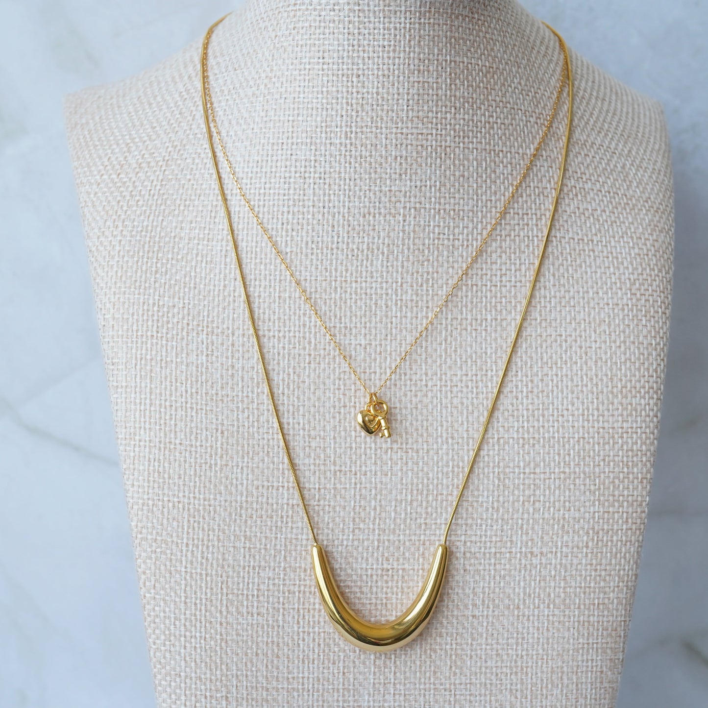 Gold key and lock charm necklace