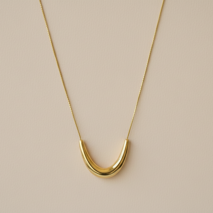 Gold curve pendant necklace
