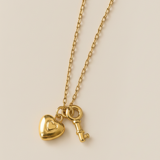 Gold key and lock charm necklace