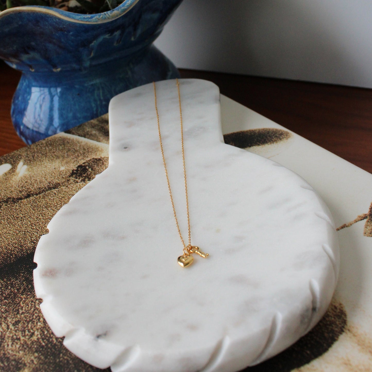 Gold key and lock charm necklace
