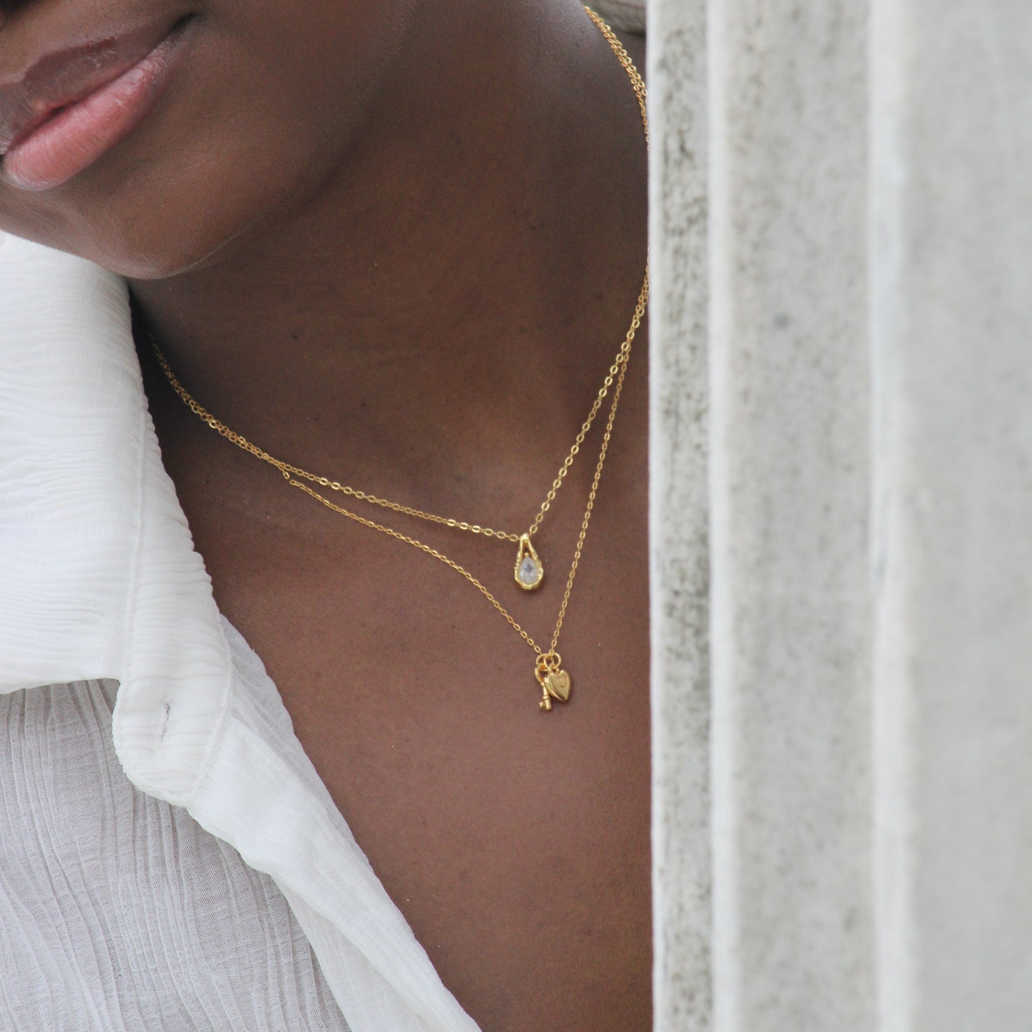 Gold key and lock charm necklace